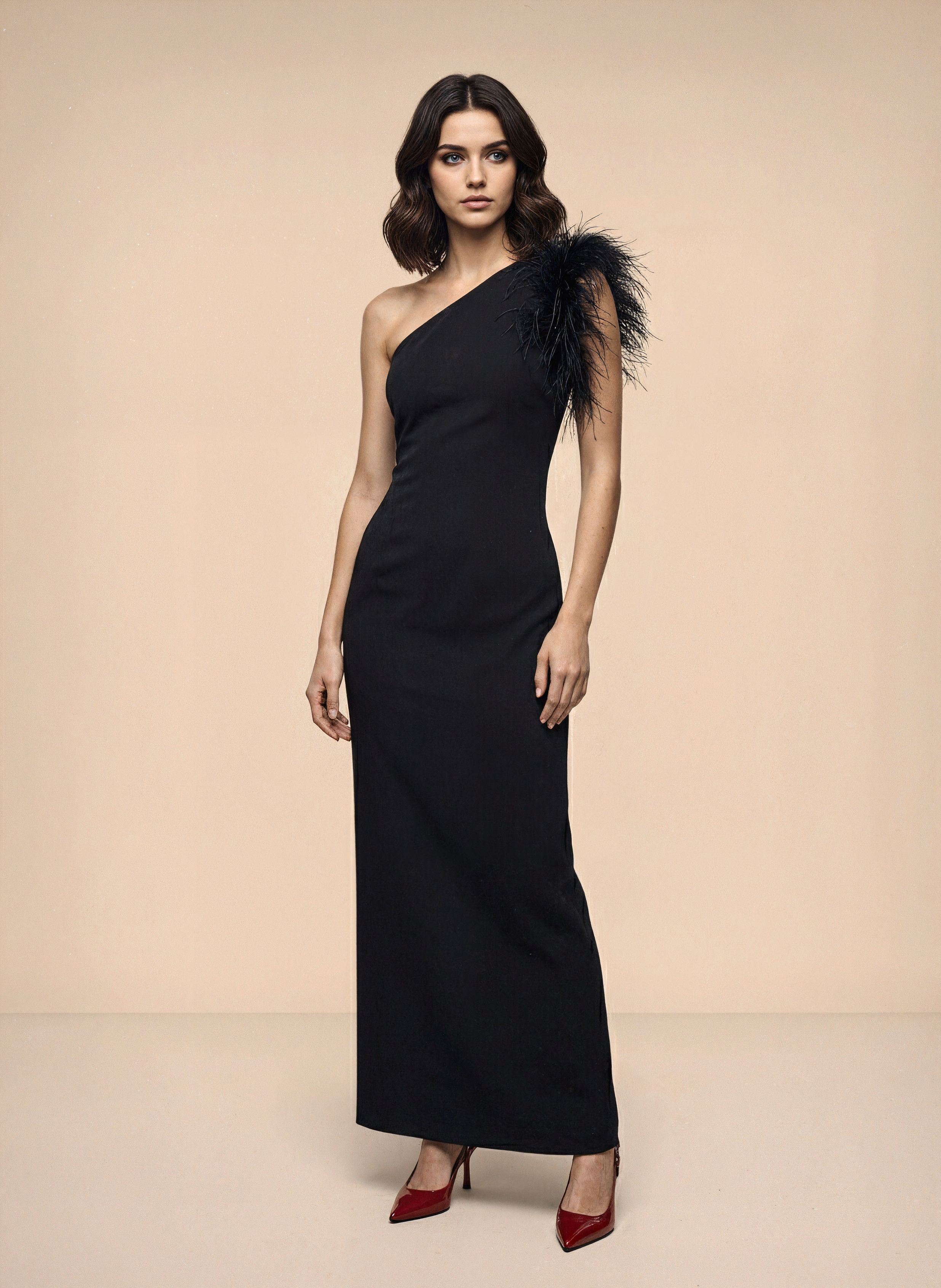 Evening dress with slanted shoulder detailing and feather trim